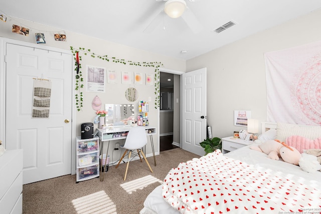 bedroom with carpet floors, visible vents, and ceiling fan