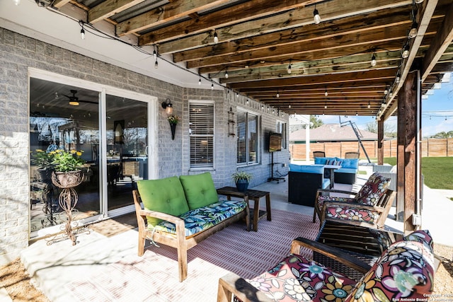 wooden terrace with fence and outdoor lounge area