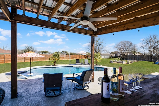 view of patio / terrace featuring a fenced backyard, a ceiling fan, and a fenced in pool