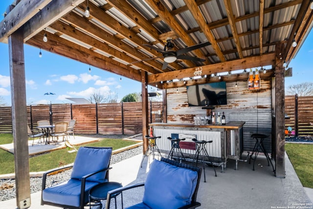 view of patio / terrace with a fenced backyard and outdoor dry bar