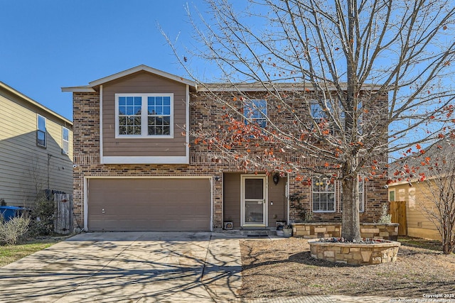 view of front of house with a garage, concrete driveway, and brick siding