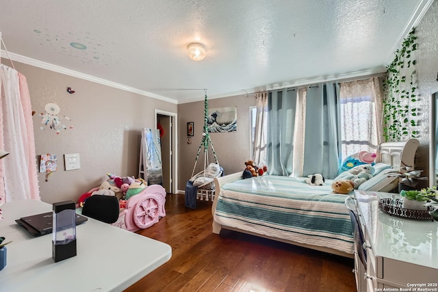 bedroom featuring a textured ceiling, dark wood-style flooring, and crown molding