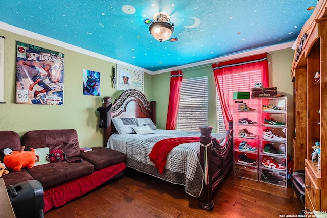 bedroom with ornamental molding and wood-type flooring