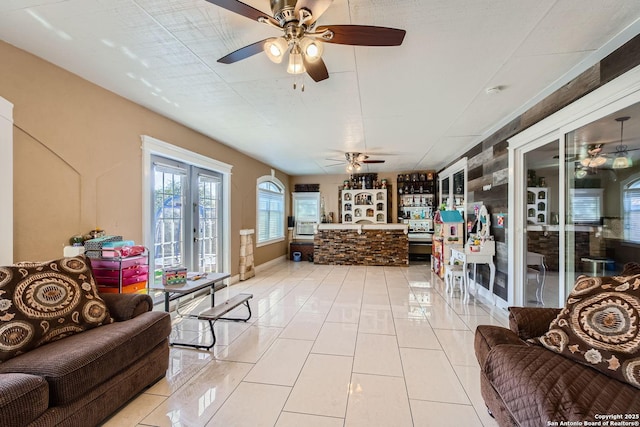 interior space with french doors and a ceiling fan