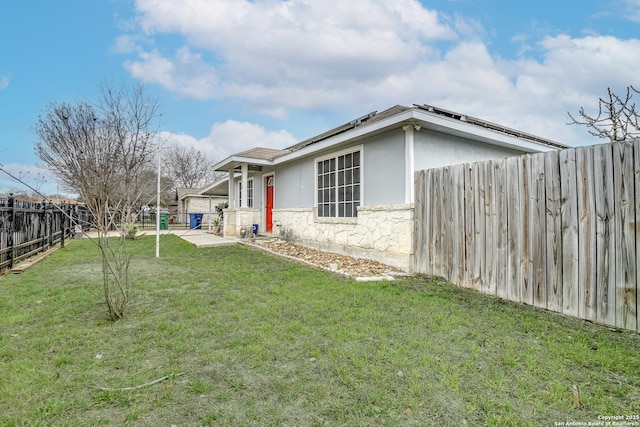 exterior space with a fenced backyard