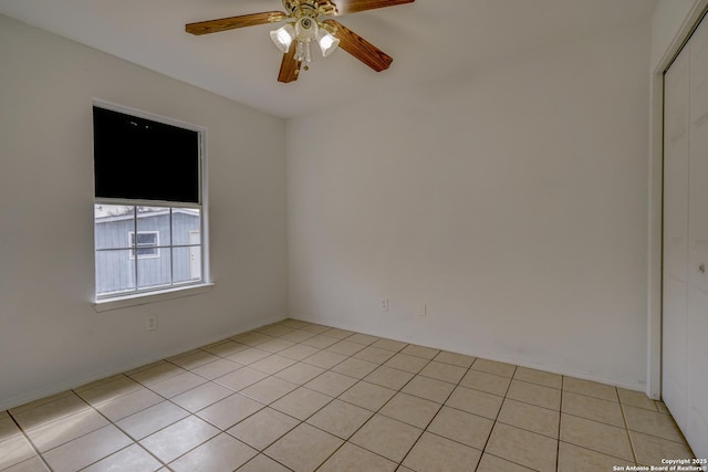 unfurnished room featuring a ceiling fan