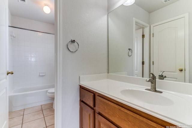 full bathroom with bathing tub / shower combination, visible vents, toilet, vanity, and tile patterned floors