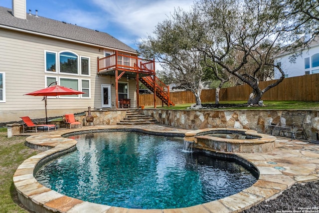 view of swimming pool featuring a patio, stairway, a wooden deck, and an in ground hot tub