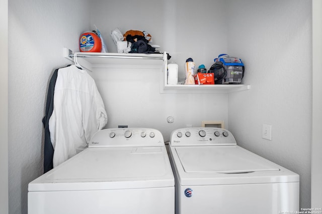 washroom with laundry area and washer and clothes dryer