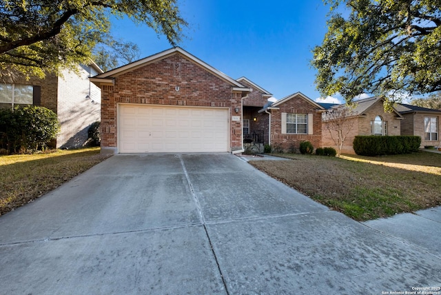 ranch-style house featuring a garage, driveway, brick siding, and a front lawn