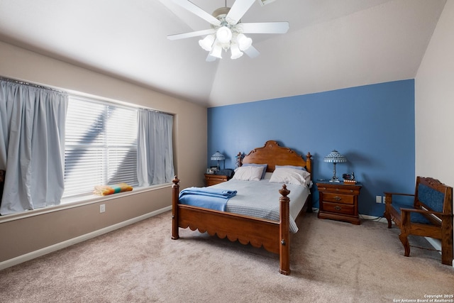 carpeted bedroom with lofted ceiling, ceiling fan, and baseboards