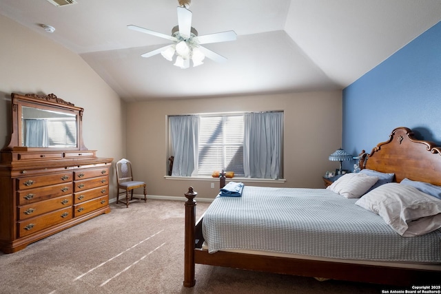 carpeted bedroom featuring lofted ceiling, ceiling fan, and baseboards