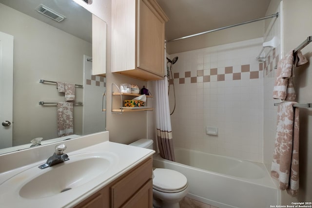 full bathroom featuring toilet, vanity, visible vents, and shower / tub combo with curtain