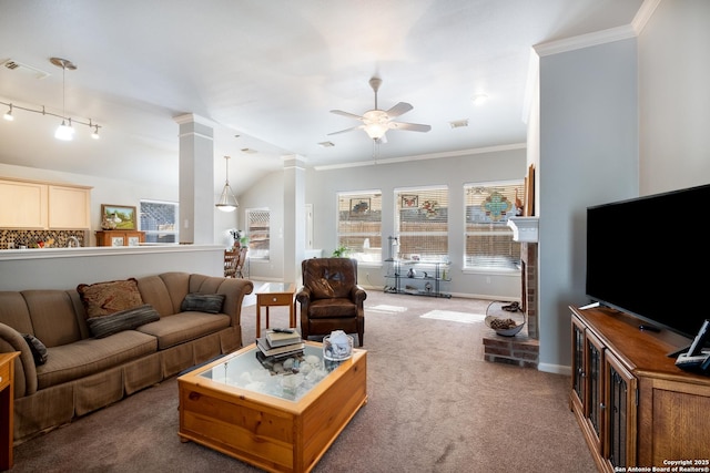 carpeted living area featuring crown molding, visible vents, decorative columns, and a ceiling fan