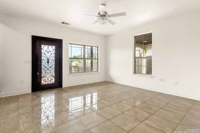 entrance foyer featuring visible vents, ceiling fan, and baseboards