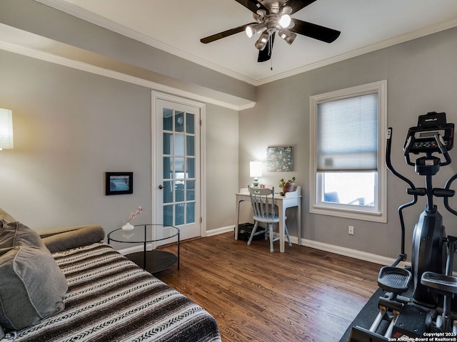 bedroom featuring baseboards, ceiling fan, wood finished floors, and crown molding