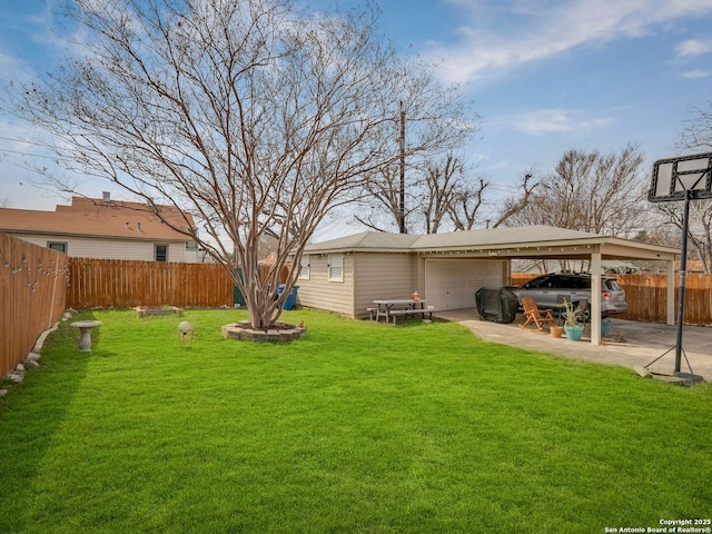 view of yard with a fenced backyard and an outdoor structure