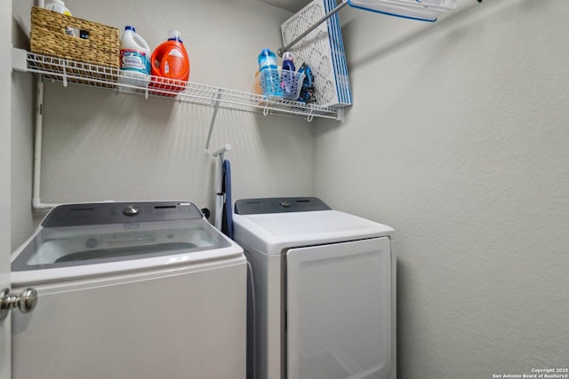 laundry room featuring laundry area and washer and clothes dryer