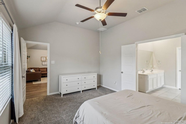 bedroom featuring visible vents, a ceiling fan, light carpet, vaulted ceiling, and baseboards