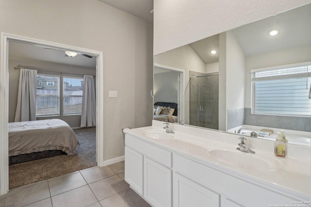 bathroom with a healthy amount of sunlight, a sink, and ensuite bath