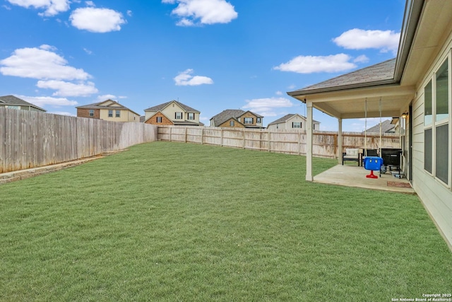 view of yard with a patio and a fenced backyard