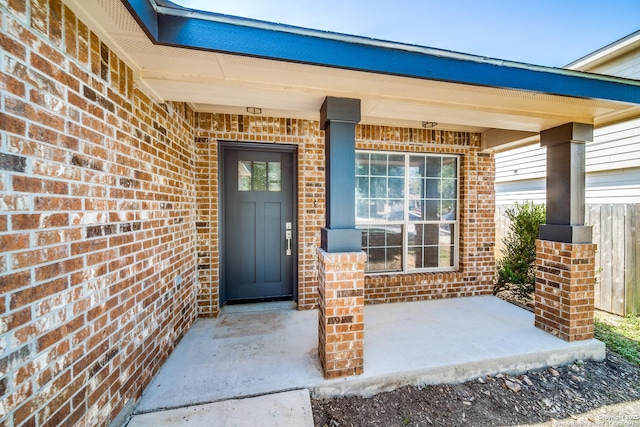 property entrance with brick siding