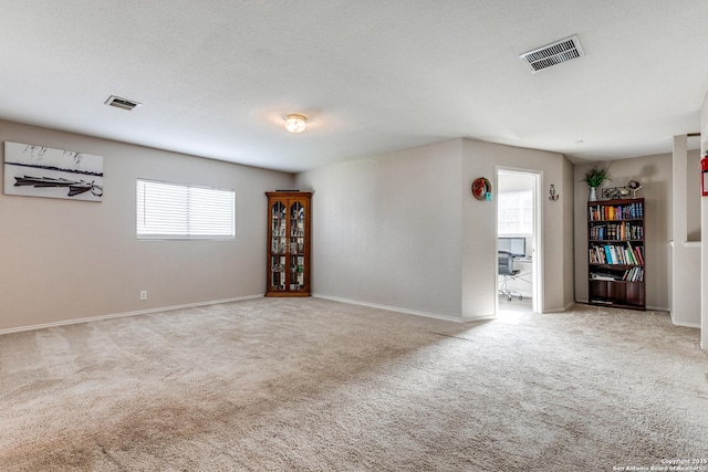 215 Quince Flower, San Antonio, TX 78253 - empty room with carpet floors, visible vents, a textured ceiling, and baseboards