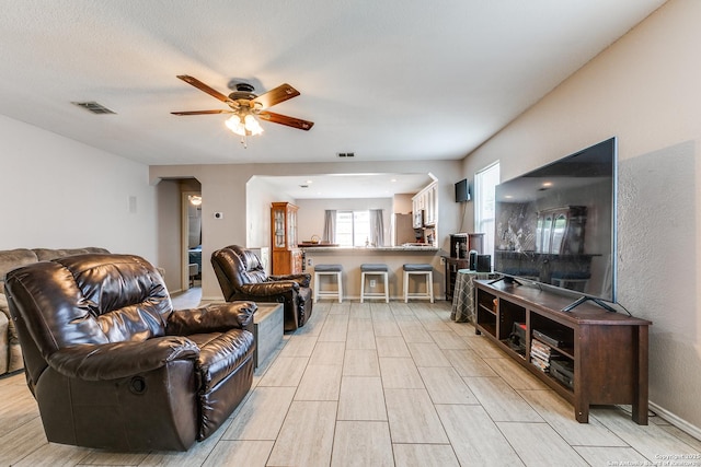 215 Quince Flower, San Antonio, TX 78253 - living room with a ceiling fan and visible vents