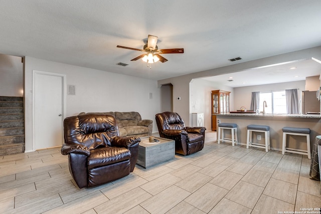 215 Quince Flower, San Antonio, TX 78253 - living area with stairway, ceiling fan, visible vents, and wood finish floors