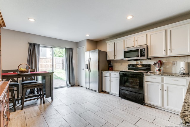 215 Quince Flower, San Antonio, TX 78253 - kitchen with tasteful backsplash, appliances with stainless steel finishes, and white cabinets