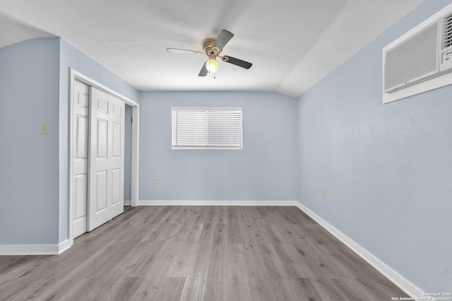 unfurnished bedroom featuring wood finished floors, visible vents, and baseboards