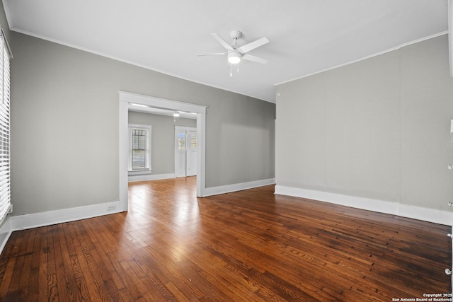 spare room featuring ceiling fan, ornamental molding, hardwood / wood-style flooring, and baseboards