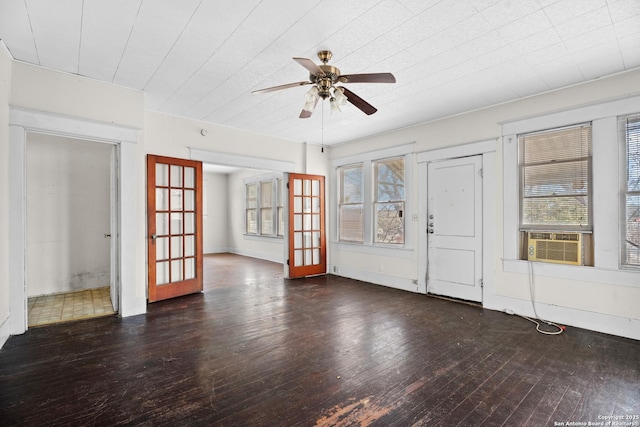 interior space featuring a healthy amount of sunlight, wood-type flooring, cooling unit, and french doors