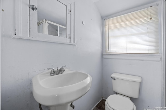 bathroom featuring toilet and a sink