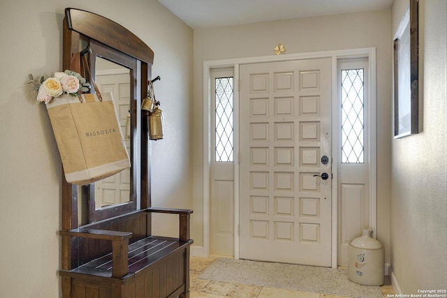 entryway featuring baseboards