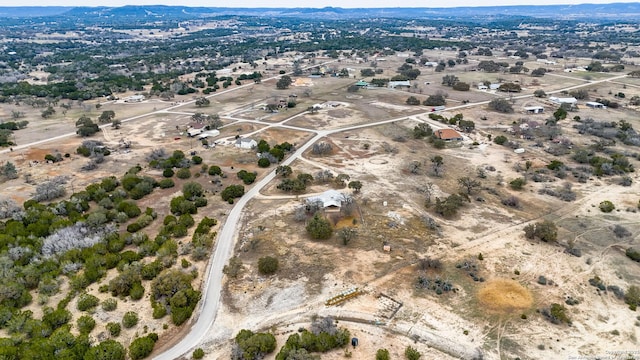 birds eye view of property with a rural view