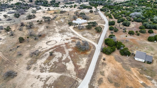 birds eye view of property with a rural view