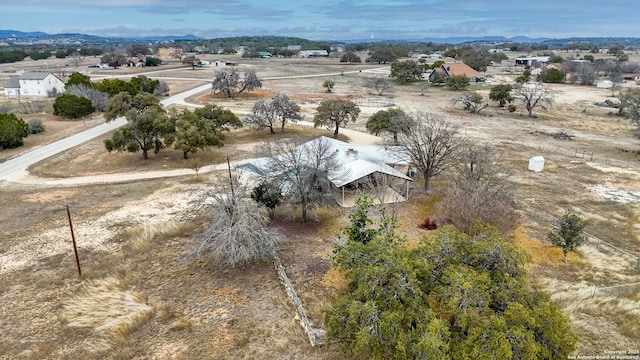 birds eye view of property with a rural view and a mountain view