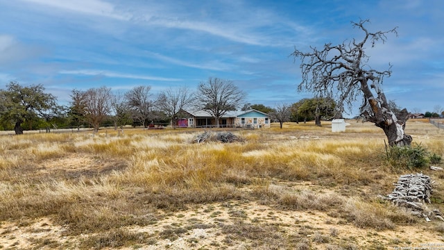 view of yard with a rural view