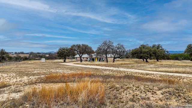 view of yard with a rural view