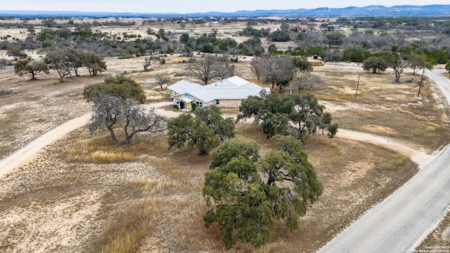 birds eye view of property featuring a rural view and a mountain view