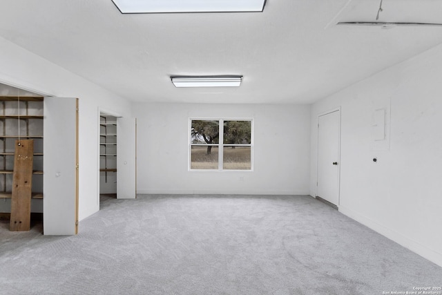 unfurnished bedroom featuring carpet and baseboards