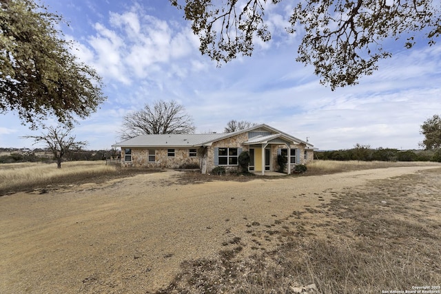 view of front of house with stone siding