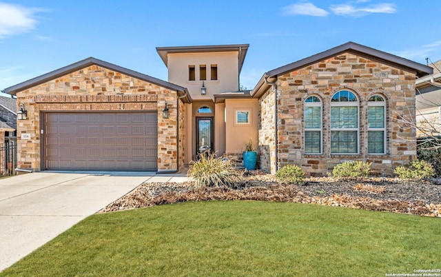 view of front of property featuring an attached garage, a front lawn, concrete driveway, and stucco siding