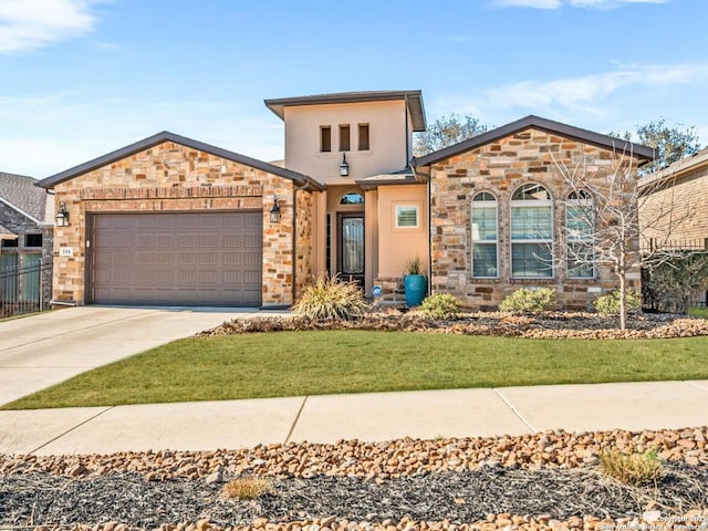 view of front of house with stucco siding, a garage, stone siding, driveway, and a front lawn