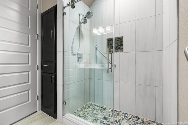 full bath with a shower stall