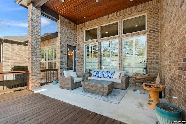 wooden terrace with outdoor lounge area