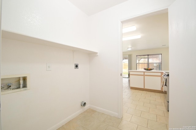 laundry area with laundry area, light tile patterned floors, baseboards, washer hookup, and electric dryer hookup