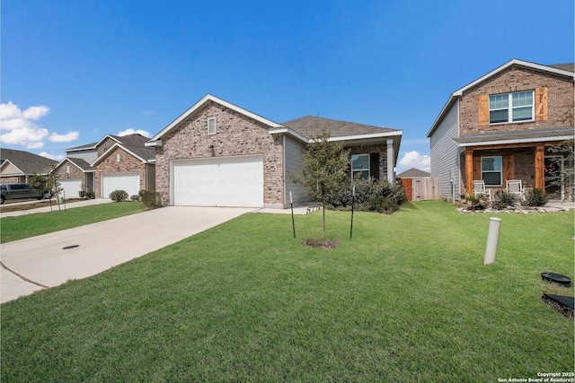 view of front facade with driveway, a front lawn, an attached garage, and brick siding