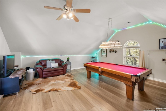 rec room with ceiling fan, billiards, wood finished floors, baseboards, and vaulted ceiling